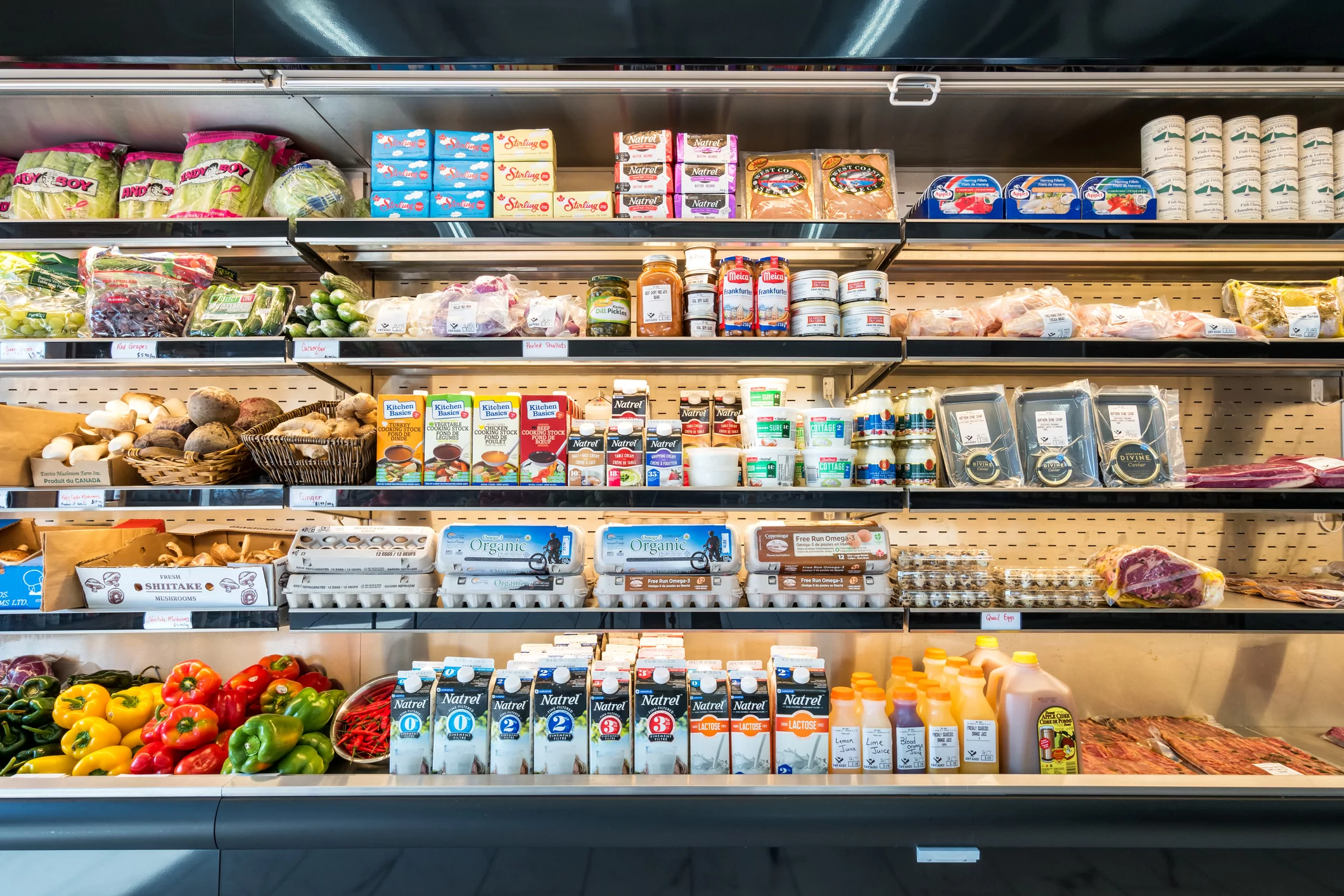refrigerator shelves in a grocery delicatessen store